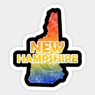 Colorful mandala art map of New Hampshire with text in blue, yellow, and red Sticker